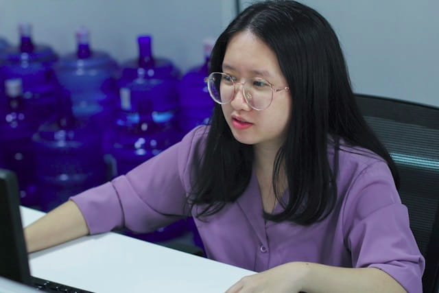 Creative professional working at a computer in a modern office.